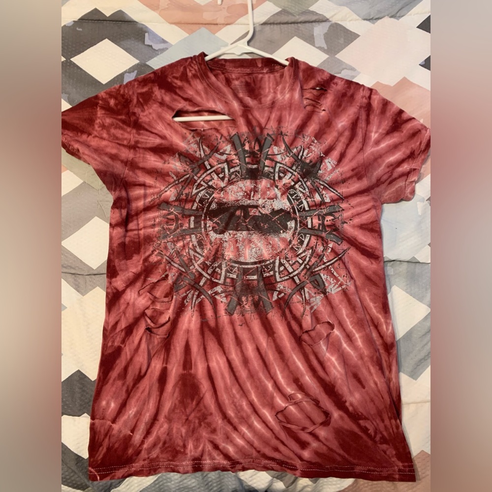 Red tie dye t-shirt. Bought it ripped.